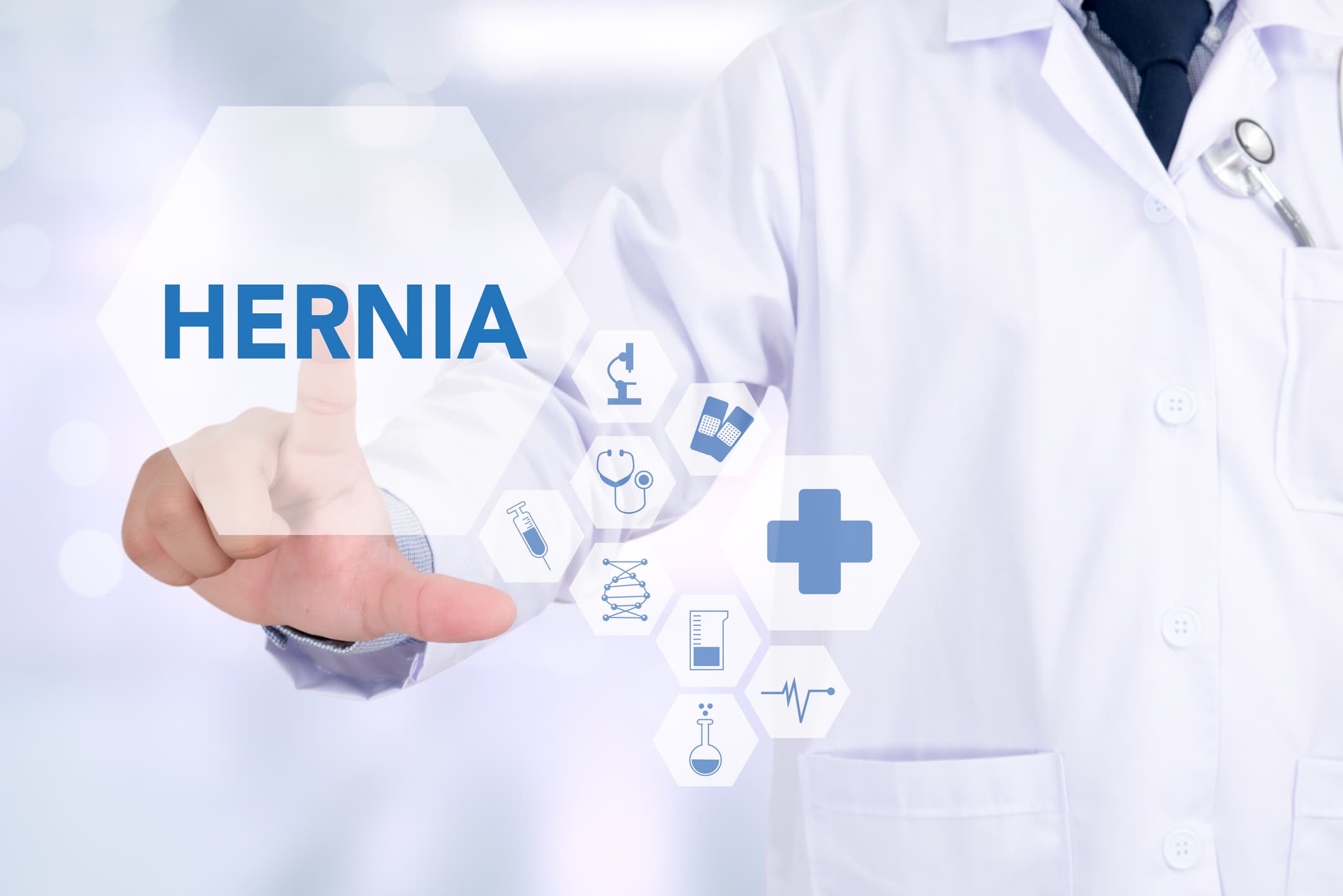 Doctor touching graphic spelling out the letters hernia